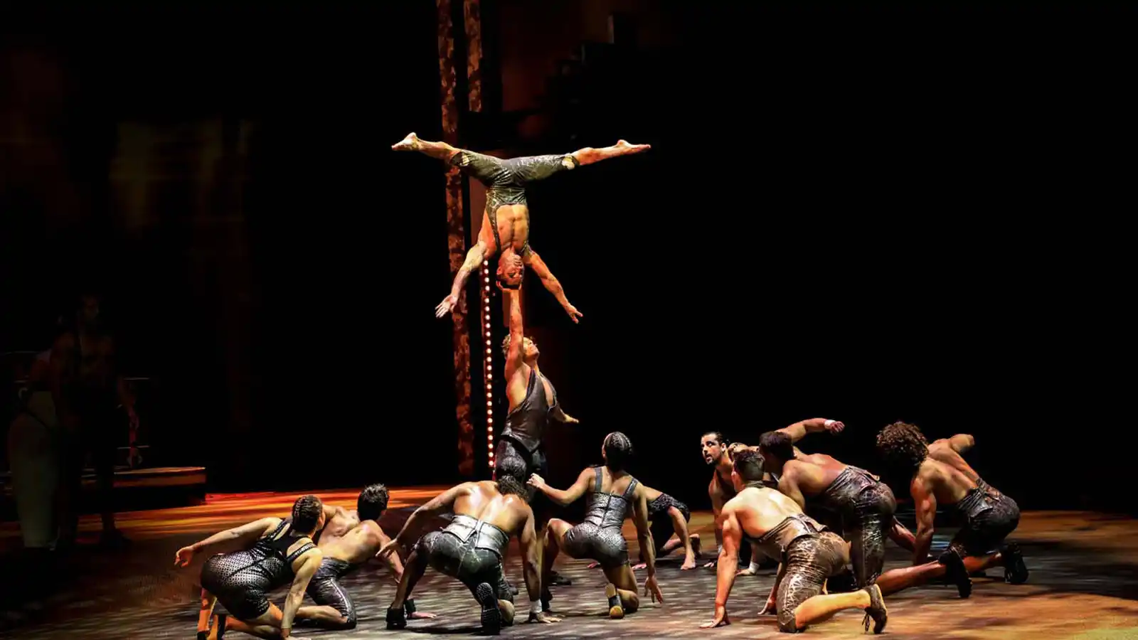 Cast members demonstrating extraordinary balance and strength at La Perle Dubai.